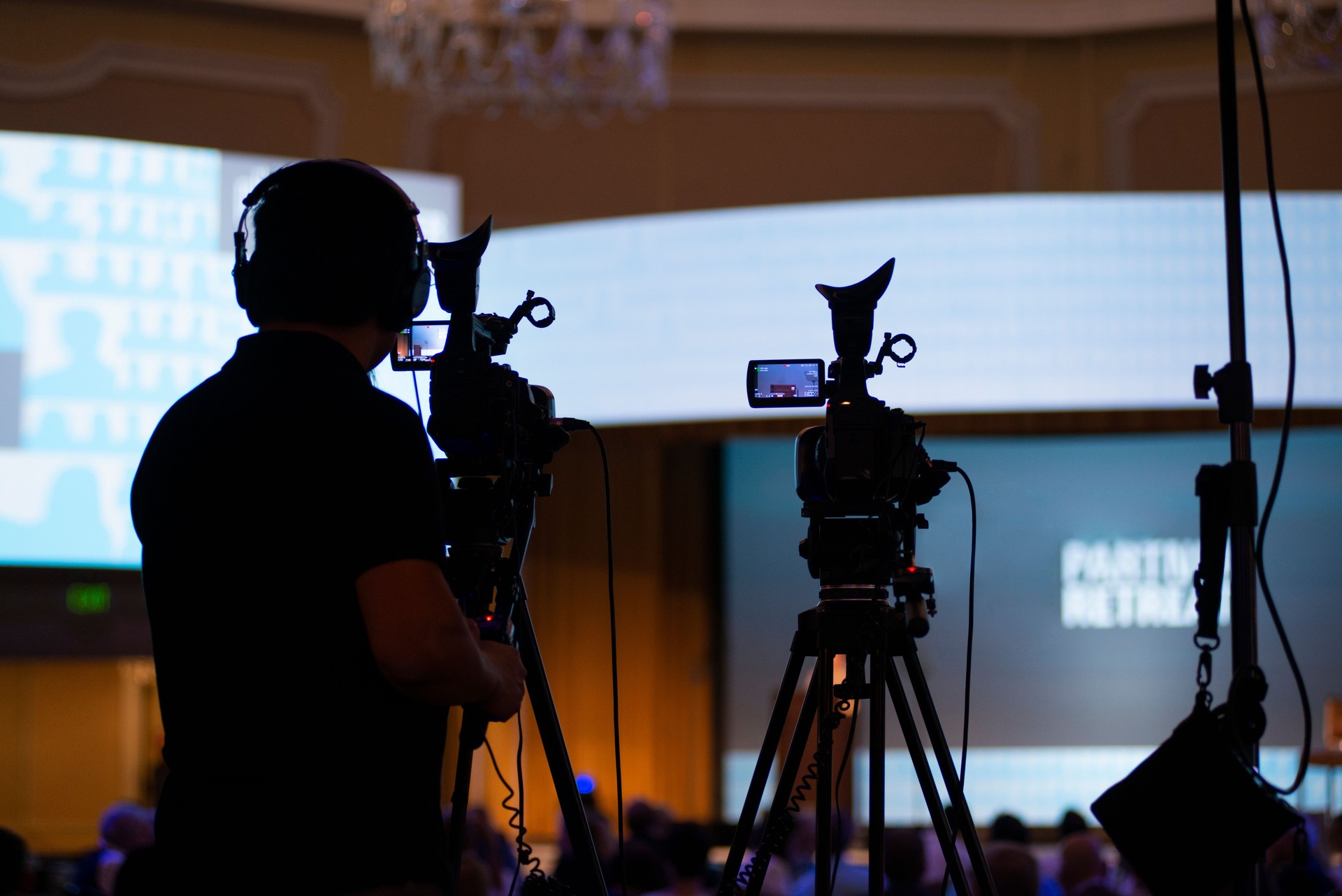 Camera Man Capturing Onstage Event